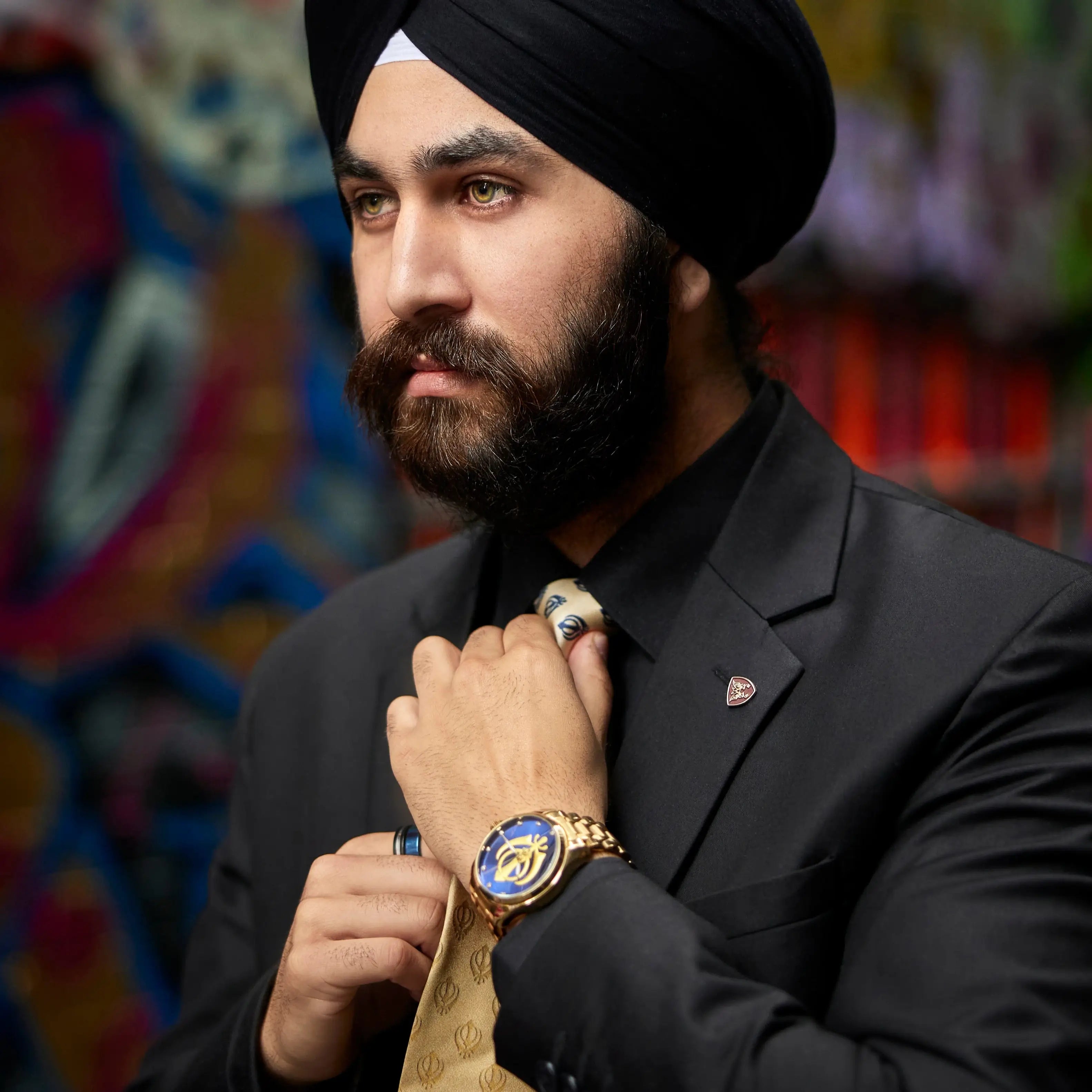 Sikh man wearing Heritage Men watch and fixing its necktie