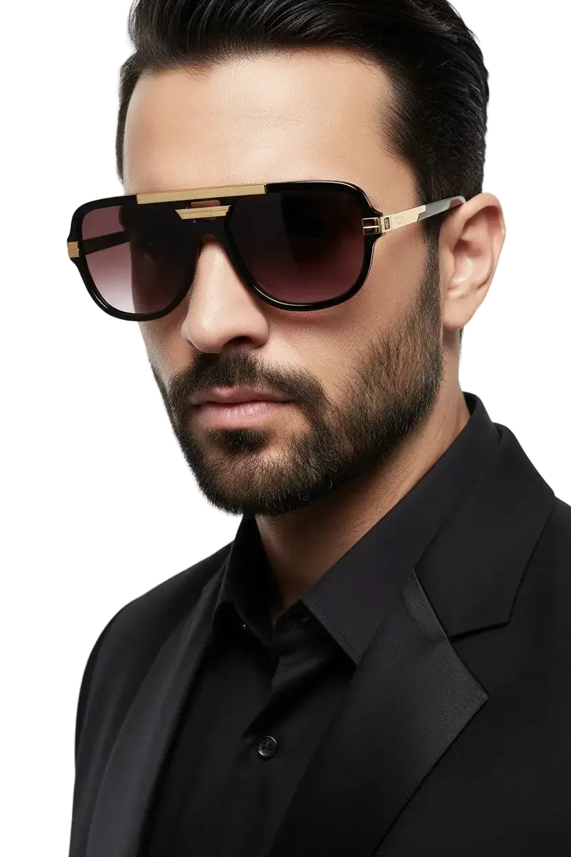 Man wearing a black suit and Khalsa 1699 sunglasses with a neutral background