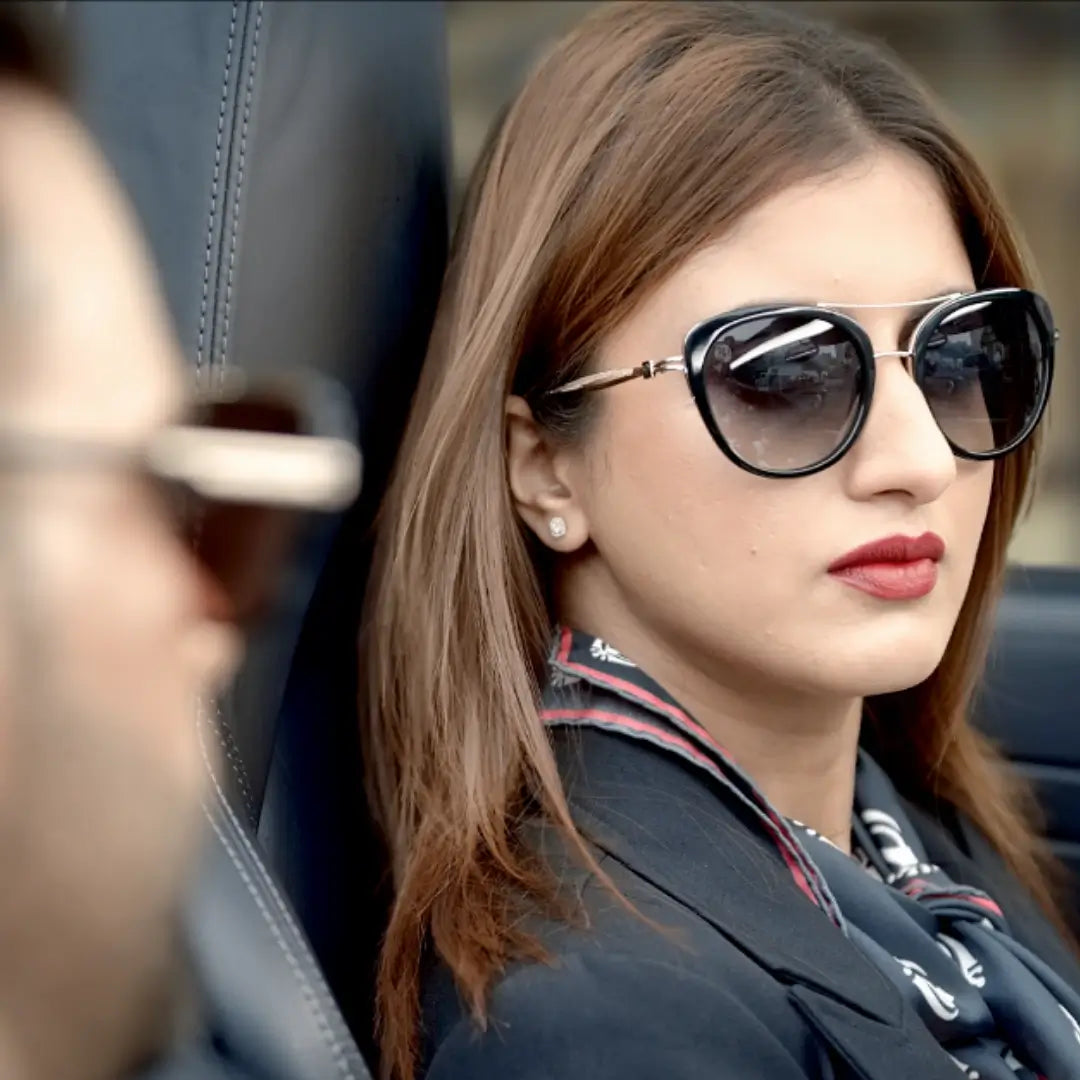 Sikh woman wearing House of Khalsa Sunglasses in a car